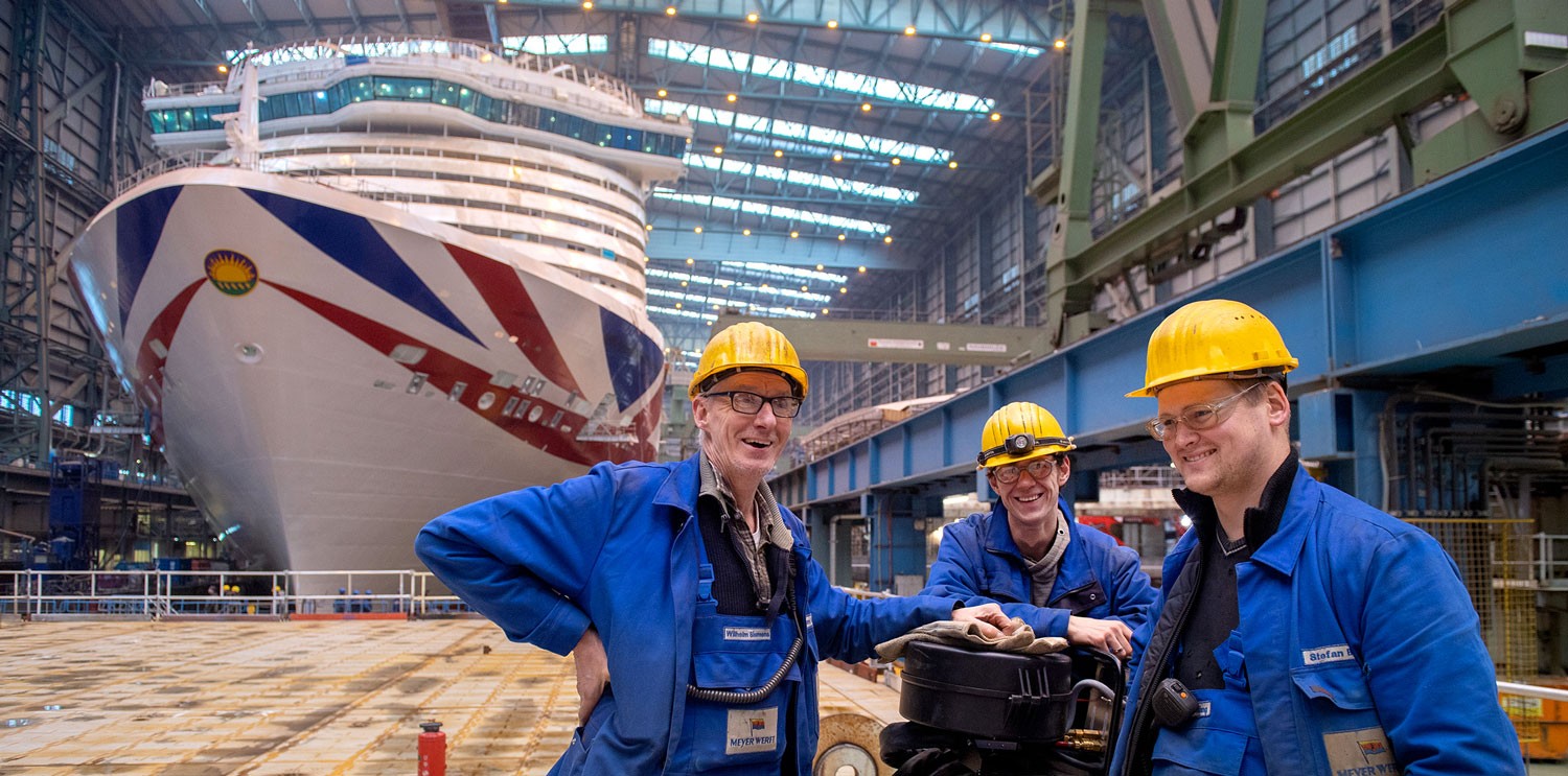 Meyer Werft workers in front of the Iona, an LNG-powered cruise ship for 5,200 passengers