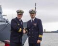 The current commander of Operational Flotilla 2, Flotilla Admiral Axel Schulz, and the current Chief of Staff and designated commander of EF2, Captain Sven Beck, pose in front of the troop flag and the frigate "Sachsen". Photo: Bundeswehr / Rodewald