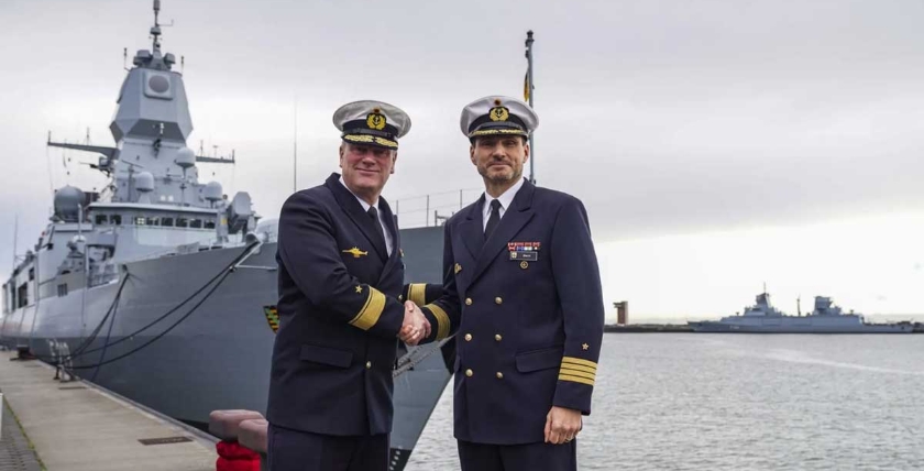 The current commander of Operational Flotilla 2, Flotilla Admiral Axel Schulz, and the current Chief of Staff and designated commander of EF2, Captain Sven Beck, pose in front of the troop flag and the frigate "Sachsen". Photo: Bundeswehr / Rodewald