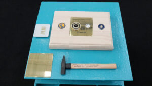 The plaque commemorating the keel laying: The symbolic plaque with the engraved coin and hammer for the keel laying of the Class 424 on 25 February 2025. photo: HSC