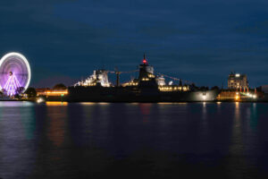 Frigate and Ferris wheel at night. Photo: Daniel Angres