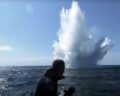 Mine divers observe the detonation of a mine in the Baltic Sea