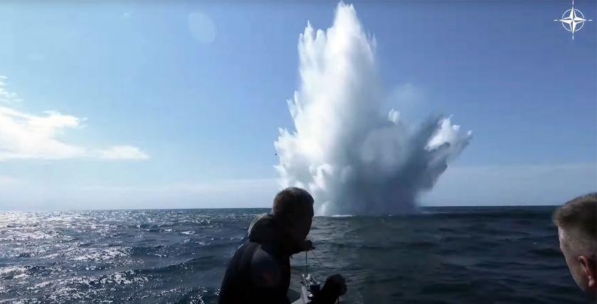 Mine divers observe the detonation of a mine in the Baltic Sea