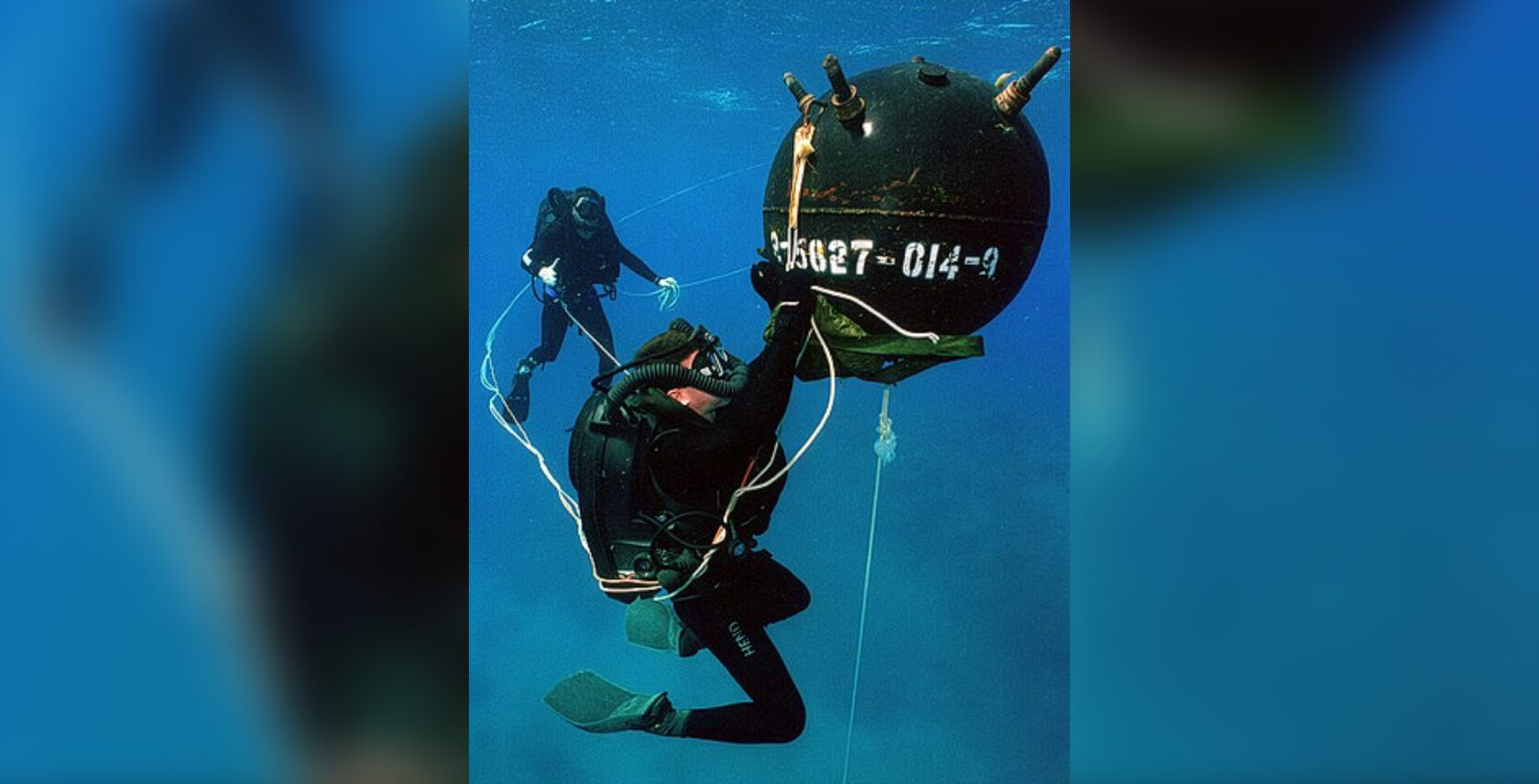 Photo: Explosive Ordnance Disposal (EOD) Divers defusing an anchor mine. U.S. Navy