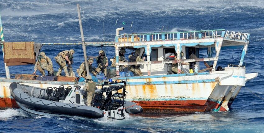 British soldiers board a suspected pirate boat. Photo: Royal Navy/Crown Copyright
