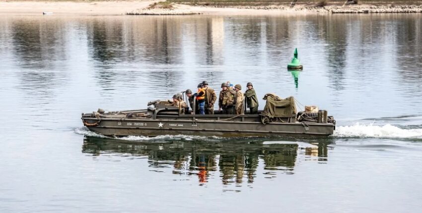 Soldiers in old military uniforms on "Tugboat Annie" on 22 March 2025. Photo: U.S. Army