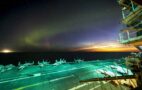 Aircraft carrier under northern lights, photo: US Navy
